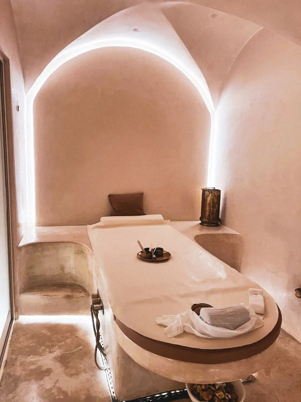 Luxurious spa relaxation room featuring minimalist interior design and ambient lighting.
