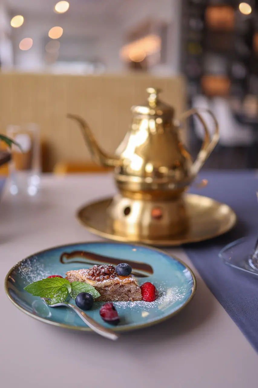 Gourmet berry cake and gold tea service